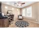 Inviting living room featuring carpet flooring, a ceiling fan and abundant natural light at 3343 E Ivanhoe St, Gilbert, AZ 85295