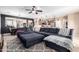 Bright living area showcasing a large blue sectional sofa and open floor plan at 3343 E Ivanhoe St, Gilbert, AZ 85295