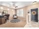 Cozy living space features a modern ceiling fan, plantation shutters, and neutral tones at 3343 E Ivanhoe St, Gilbert, AZ 85295