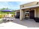 Outdoor patio with a picnic table, umbrella, grill, and sliding door entrance at 3343 E Ivanhoe St, Gilbert, AZ 85295