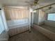A bedroom with built-in storage and a mirrored closet offers ample space and convenience at 3520 N Yucca Dr, Florence, AZ 85132