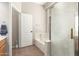 Bathroom with walk-in shower, soaking tub, and wood cabinets at 3668 E Cody Ave, Gilbert, AZ 85234