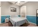 Comfortable bedroom with gray and blue walls, and a patterned bedspread with great natural light at 3668 E Cody Ave, Gilbert, AZ 85234