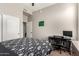Well-lit bedroom with a comfortable bed, a study desk, and modern furnishings creating a cozy atmosphere at 3668 E Cody Ave, Gilbert, AZ 85234