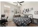 Serene bedroom featuring a comfortable bed with a workspace and ample wall decor for personalization at 3668 E Cody Ave, Gilbert, AZ 85234