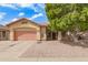 Attractive single-story home featuring a two-car garage, a low-maintenance gravel yard, and a mature shade tree at 3668 E Cody Ave, Gilbert, AZ 85234