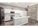 Bright kitchen featuring granite countertops, stainless steel appliances, and tile backsplash at 3668 E Cody Ave, Gilbert, AZ 85234