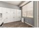 Functional pantry featuring ample white cabinetry and wood-look floors for convenient storage at 3668 E Cody Ave, Gilbert, AZ 85234