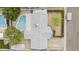 Aerial view of a home with a backyard pool, shed and patio surrounded by mature trees and greenery at 3802 W Rue De Lamour Ave, Phoenix, AZ 85029