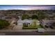 Beautiful suburban home with a well-manicured lawn and a long driveway, perfect for Gathering living at 3802 W Rue De Lamour Ave, Phoenix, AZ 85029
