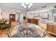 View of open concept dining room, kitchen, and living spaces at 3802 W Rue De Lamour Ave, Phoenix, AZ 85029