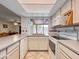 Bright kitchen with white cabinets and modern appliances at 3802 W Rue De Lamour Ave, Phoenix, AZ 85029