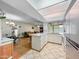 Open kitchen with an island and an open view to dining room at 3802 W Rue De Lamour Ave, Phoenix, AZ 85029