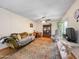Living room with comfortable seating, and bright window at 3802 W Rue De Lamour Ave, Phoenix, AZ 85029