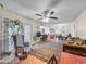 Spacious living room with hardwood floors and ample natural light at 3802 W Rue De Lamour Ave, Phoenix, AZ 85029