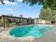Beautiful backyard with a sparkling pool and patio, perfect for relaxing and entertaining friends at 3802 W Rue De Lamour Ave, Phoenix, AZ 85029