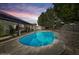 Backyard pool with patio, perfect for relaxation and outdoor gatherings under a colorful sunset at 3802 W Rue De Lamour Ave, Phoenix, AZ 85029