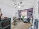 Spacious spare room with shelving and sewing machine for hobbies or storage with a ceiling fan at 3802 W Rue De Lamour Ave, Phoenix, AZ 85029