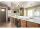 Bathroom features a dual sink vanity, large mirror, and tiled floors at 38397 N Nuevo Laredo Ln, San Tan Valley, AZ 85140