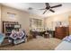 Bedroom with carpet, a ceiling fan, a work station, and two beds at 38397 N Nuevo Laredo Ln, San Tan Valley, AZ 85140