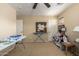 Bedroom features carpet and walls, a ceiling fan, and tables at 38397 N Nuevo Laredo Ln, San Tan Valley, AZ 85140