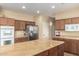 Large kitchen offers plentiful counter space, an island, and stainless steel appliances at 38397 N Nuevo Laredo Ln, San Tan Valley, AZ 85140