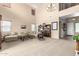 Expansive living room with soaring ceilings, large windows, and neutral decor at 38397 N Nuevo Laredo Ln, San Tan Valley, AZ 85140