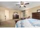 Large main bedroom with dresser, mirror, and access to a staircase at 38397 N Nuevo Laredo Ln, San Tan Valley, AZ 85140