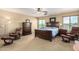 Bright main bedroom with a large bed, two chairs and a chest of drawers at 38397 N Nuevo Laredo Ln, San Tan Valley, AZ 85140