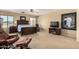 Spacious main bedroom featuring comfortable seating, a ceiling fan, and carpeted floors at 38397 N Nuevo Laredo Ln, San Tan Valley, AZ 85140