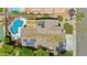 Aerial view showcasing the newly remodeled pool and the home's paid-off solar panels at 384 N Scott Dr, Chandler, AZ 85225