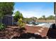 Well maintained landscaped backyard with pool, chairs, and shed at 384 N Scott Dr, Chandler, AZ 85225