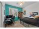 The bedroom has carpet, ceiling fan, and a dedicated desk area at 384 N Scott Dr, Chandler, AZ 85225
