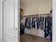 The closet has built-in shelving and hanging rods for storage at 384 N Scott Dr, Chandler, AZ 85225