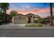 Charming single-Gathering home featuring a two-car garage, desert landscaping, and a cozy front entrance at 384 N Scott Dr, Chandler, AZ 85225