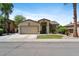 Charming single-Gathering home featuring a two-car garage, desert landscaping, and a cozy front entrance at 384 N Scott Dr, Chandler, AZ 85225
