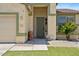 Inviting entryway featuring a stylish front door and decorative landscaping elements at 384 N Scott Dr, Chandler, AZ 85225