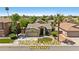 Charming single-story home with desert landscaping, paid-off solar panels, and a two-car garage at 384 N Scott Dr, Chandler, AZ 85225