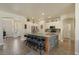 Kitchen boasts granite countertops, stainless appliances, ample cabinet space, and a center island with barstool seating at 384 N Scott Dr, Chandler, AZ 85225