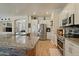 Spacious kitchen with stainless steel appliances, granite countertops, and ample cabinetry for efficient storage and functionality at 384 N Scott Dr, Chandler, AZ 85225