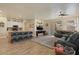 Open-concept living room features counter seating, updated lighting fixtures, and a cozy space for entertaining guests at 384 N Scott Dr, Chandler, AZ 85225