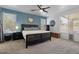 Serene main bedroom with a blue accent wall, a large window, carpet and ample space for relaxation at 384 N Scott Dr, Chandler, AZ 85225