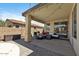 Covered outdoor patio featuring comfortable seating and outdoor cooking area at 384 N Scott Dr, Chandler, AZ 85225
