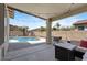 Spacious covered patio and pool area in a lovely backyard at 384 N Scott Dr, Chandler, AZ 85225