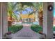 Inviting backyard oasis with a sparkling pool, lush landscaping, and a shaded patio perfect for relaxing at 45176 W Alamendras St, Maricopa, AZ 85139