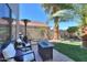 Well-maintained backyard with desert landscaping and a patio area ideal for outdoor seating and entertaining at 45176 W Alamendras St, Maricopa, AZ 85139