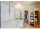 Bright bathroom with a bathtub, shower, and closet for extra storage for toiletries and linens at 45176 W Alamendras St, Maricopa, AZ 85139