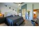 Inviting bedroom with stylish decor, a comfortable bed, and an ensuite bathroom for convenience at 45176 W Alamendras St, Maricopa, AZ 85139