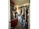 Walk-in closet featuring custom shelving, ample hanging space, and stylish organization solutions for clothes and accessories at 45176 W Alamendras St, Maricopa, AZ 85139