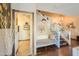 Inviting entryway with a bench, stylish decor, and stairway to the upper level at 45176 W Alamendras St, Maricopa, AZ 85139